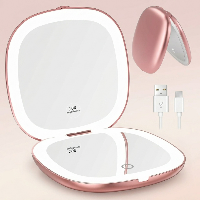 LED travel makeup mirror in pink, shown closed and open with LED lights on
