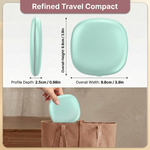 Pink LED travel makeup mirror being carried in a pocket, showing its compact size