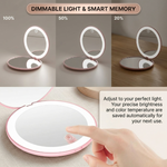 Pink LED travel makeup mirror being carried in a pocket, showing its compact size
