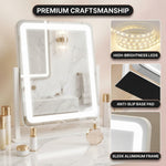 Hands attaching the magnetic 20X magnifier to the LED vanity mirror surface