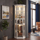 Oak lighted corner curio cabinet displaying crystal and glassware in a living-room corner