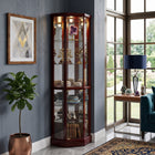 Oak lighted corner curio cabinet displaying crystal and glassware in a living-room corner