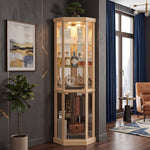 Oak lighted corner curio cabinet displaying crystal and glassware in a living-room corner