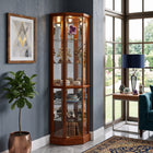 Oak lighted corner curio cabinet displaying crystal and glassware in a living-room corner