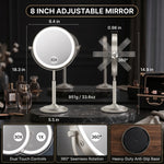 Woman applying makeup at a vanity using the lighted magnifying mirror