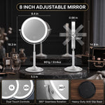 Woman applying makeup at a vanity using the lighted magnifying mirror