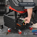 Person detailing a grey car beside the rolling mechanic stool with five swivel casters