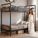 Adult standing beside a black metal bunk bed showing its full-size scale