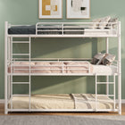 Black full-over-full metal bunk bed with ladder and guardrails in a styled bedroom