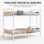 Black full-over-full metal bunk bed with ladder and guardrails in a styled bedroom