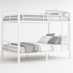 Black full-over-full metal bunk bed with ladder and guardrails in a styled bedroom