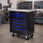 Red steel 5-drawer desktop tool box organizer, front view on workshop table