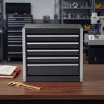 Red steel 5-drawer desktop tool box organizer, front view on workshop table