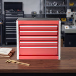 Red steel 5-drawer desktop tool box organizer, front view on workshop table