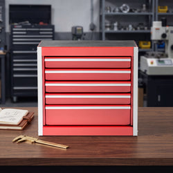 Red steel 5-drawer desktop tool box organizer, front view on workshop table