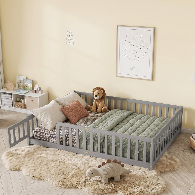 Natural wood Montessori floor bed with fence rails styled in a child's room