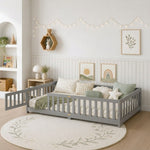 Natural wood Montessori floor bed with fence rails styled in a child's room
