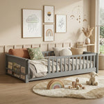 Natural wood Montessori floor bed with fence rails styled in a child's room