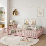 Natural wood Montessori floor bed with fence rails styled in a child's room