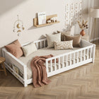 Natural wood Montessori floor bed with fence rails styled in a child's room