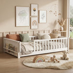 Natural wood Montessori floor bed with fence rails styled in a child's room
