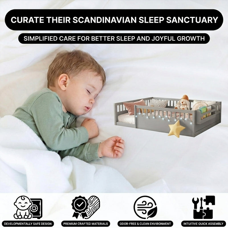 Toddler resting on a natural Montessori floor bed with fence in a forest-themed nursery