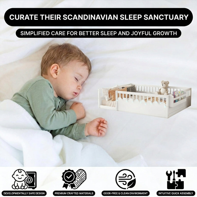 Toddler resting on a natural Montessori floor bed with fence in a forest-themed nursery