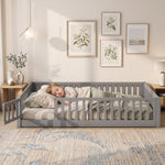 Toddler resting on a natural Montessori floor bed with fence in a forest-themed nursery