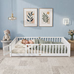 Toddler resting on a natural Montessori floor bed with fence in a forest-themed nursery