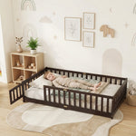 Toddler resting on a natural Montessori floor bed with fence in a forest-themed nursery