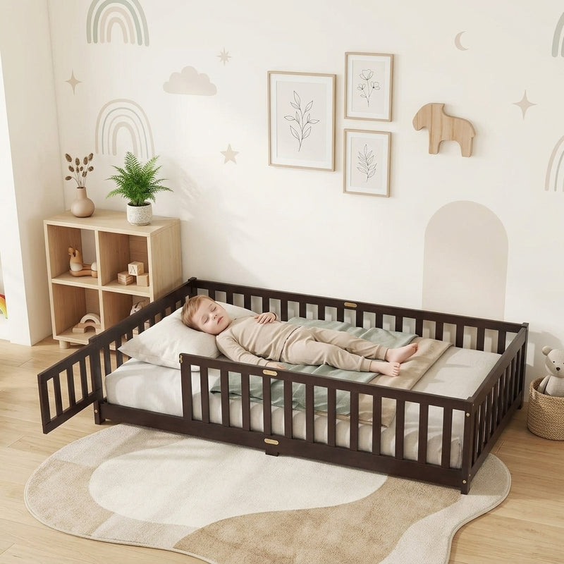 Toddler resting on a natural Montessori floor bed with fence in a forest-themed nursery