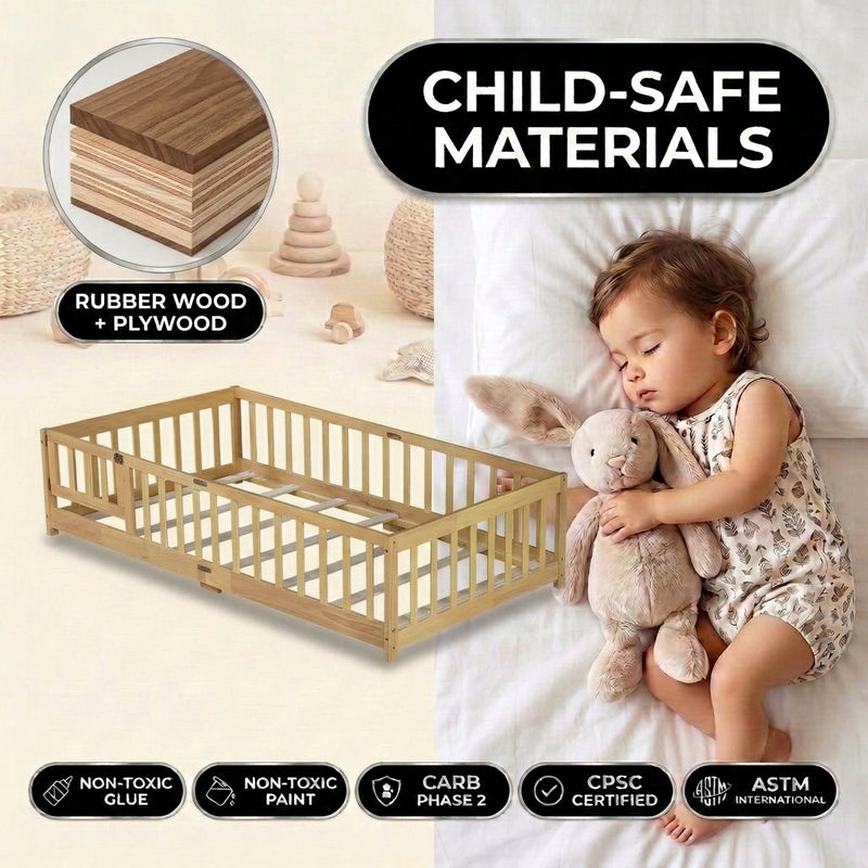 Toddler resting on a natural Montessori floor bed with fence in a forest-themed nursery