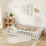 Toddler resting on a natural Montessori floor bed with fence in a forest-themed nursery