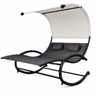 Navy outdoor chaise lounger with canopy, cushion and headrest pillow on a patio