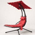 Navy outdoor chaise lounger with canopy, cushion and headrest pillow on a patio