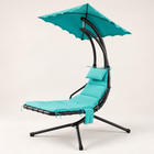 Navy outdoor chaise lounger with canopy, cushion and headrest pillow on a patio