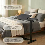 Telescoping height adjustment column on adjustable overbed table, range markers visible