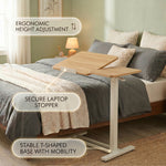 Telescoping height adjustment column on adjustable overbed table, range markers visible