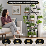 Woman placing a potted plant on a multi-tier plant stand in a bright living room