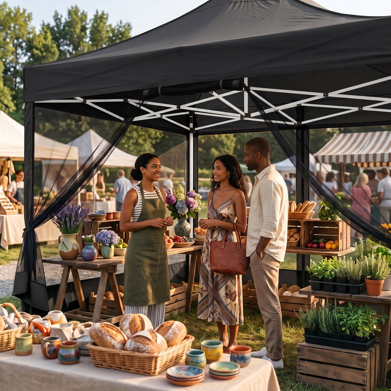 People gathered under a khaki pop-up gazebo canopy at an outdoor garden party with tables of food and flowers