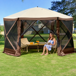 Green pop-up screen gazebo set up beside a pool with an outdoor dining table