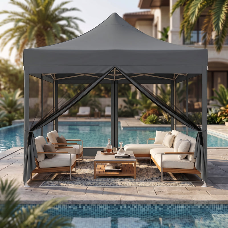 Green pop-up screen gazebo set up beside a pool with an outdoor dining table
