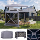 Brown and beige 6-sided pop-up screen tent gazebo set up in a mountain meadow with a table and camping chairs inside