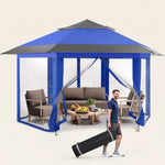 Brown and beige 6-sided pop-up screen tent gazebo set up in a mountain meadow with a table and camping chairs inside
