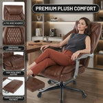 Woman reclining with feet up on the extended footrest of the black massage office chair