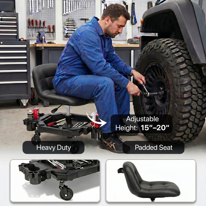 Mechanic seated on a red rolling garage stool adjusting a truck tire with a wrench