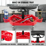 Divided red tool tray on a rolling mechanic stool holding wrenches a screwdriver and a socket set