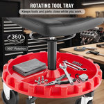 Divided red tool tray on a rolling mechanic stool holding wrenches a screwdriver and a socket set