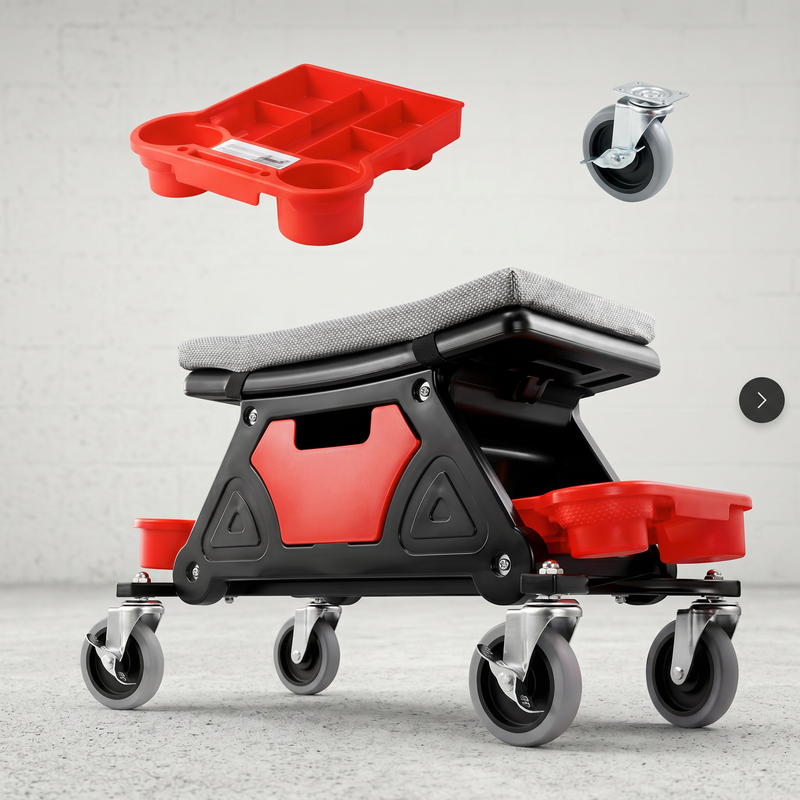 Red and black padded rolling mechanic stool with a divided tool tray and five casters in a garage