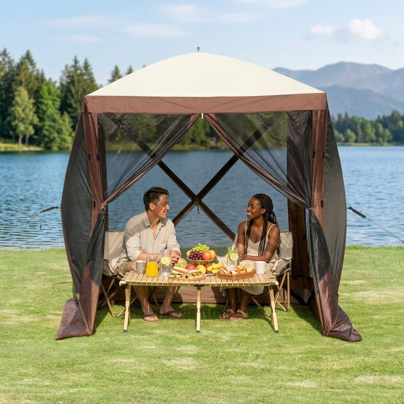 Couple picnicking inside a brown pop-up screen tent by a lake